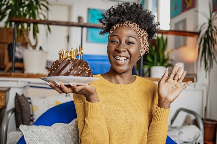 Young woman with birthday cake