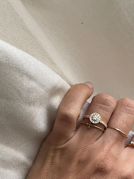 Halo settings are a popular French engagement ring style, as seen on Anne-Laure Mais Moreau.