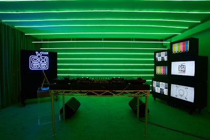 A photo of the Channel 66 studio space in New York City. It shows a spacious room in neon green ligh...