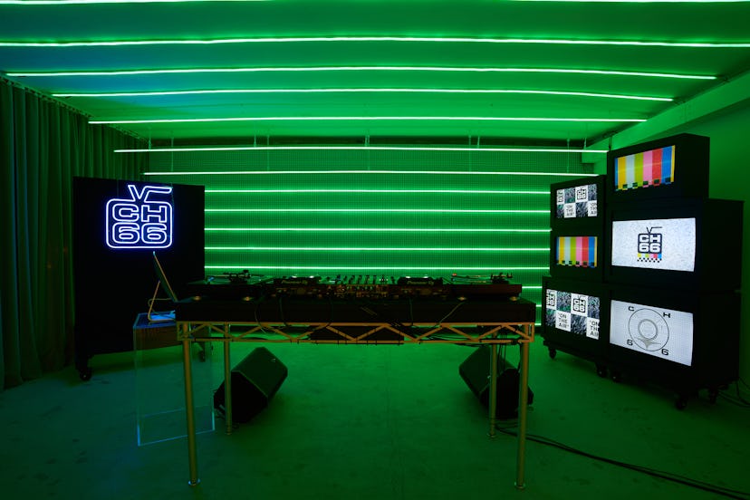 A photo of the Channel 66 studio space in New York City. It shows a spacious room in neon green ligh...