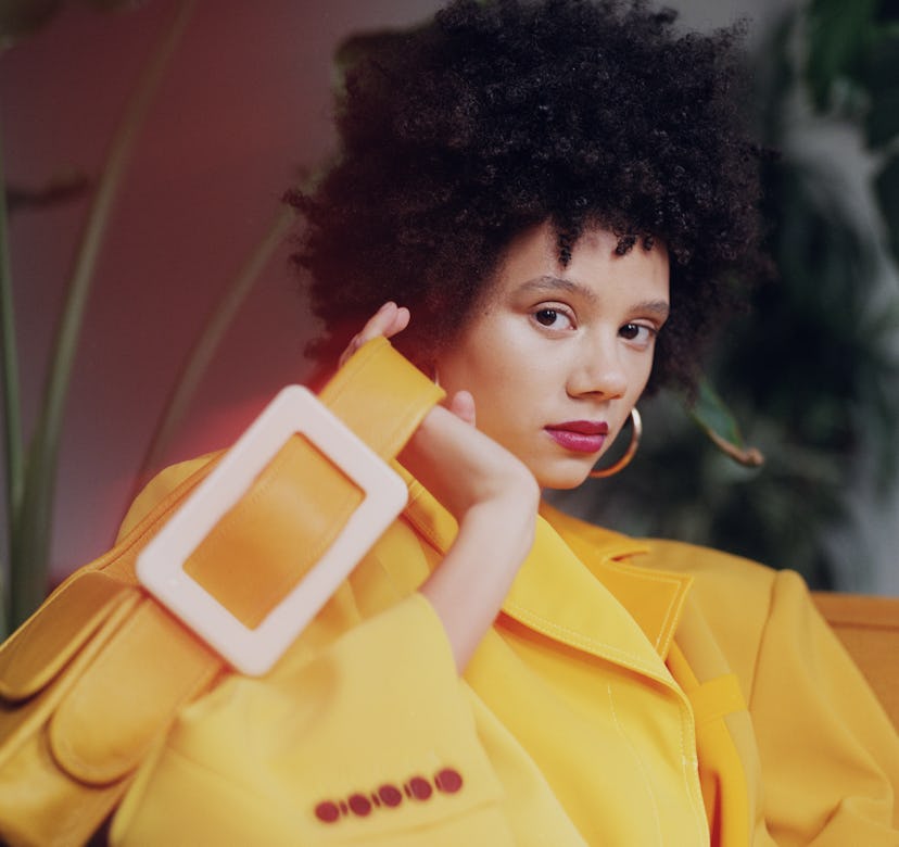Model wearing yellow outfit and carrying yellow bag for EDAS.