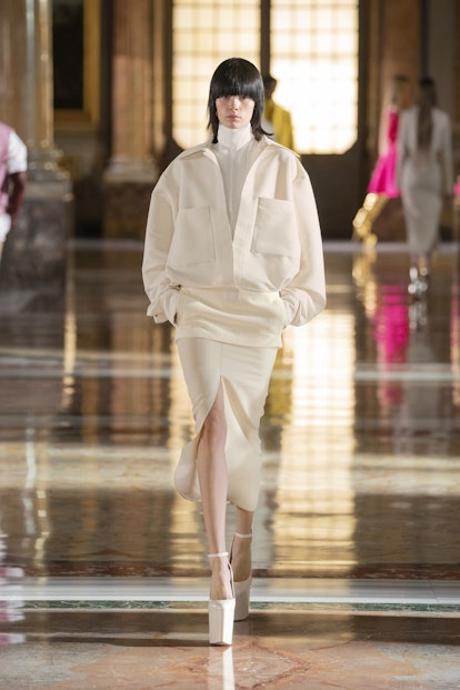 Model wears white platforms while walking during Valentino's Spring 2021 Couture show.