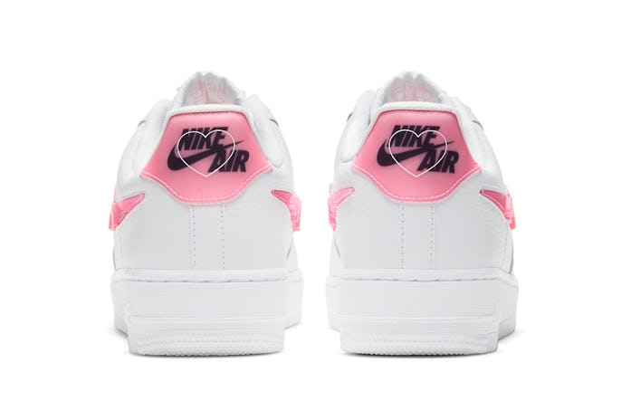 Pink heels with Nike branding and heart