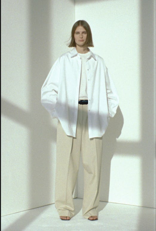 The Row spring/summer 2021 collection with a model wearing a white shirt and chino pants