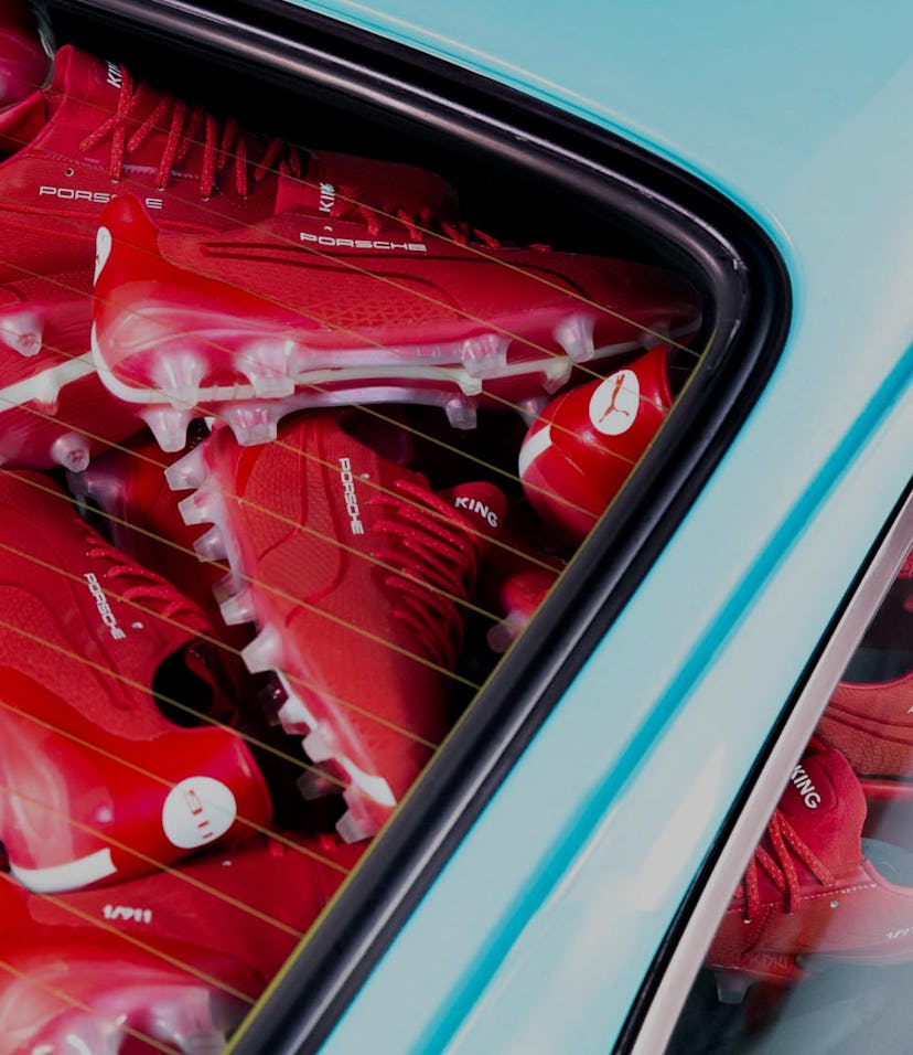 Red sneakers in a blue Porsche