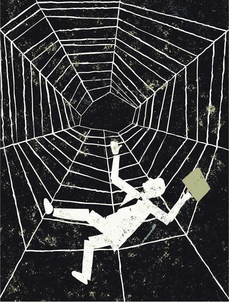 businessman falling spider web
