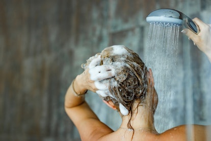 Woman washing her hair. 