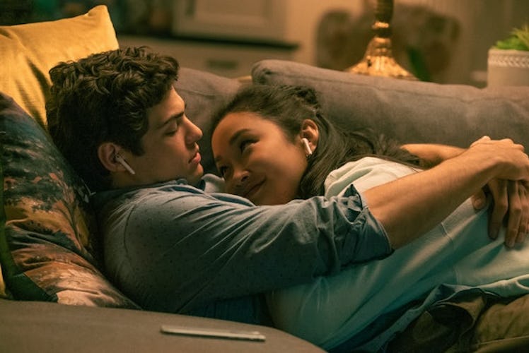 Lara Jean and Peter K in 'TATB' cuddle up on the couch while listening to music.