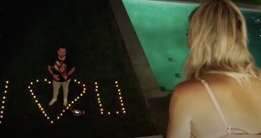 Stephen surprises Amanda with a lit-up "I heart U" sign by the pool in 'Summer House.'