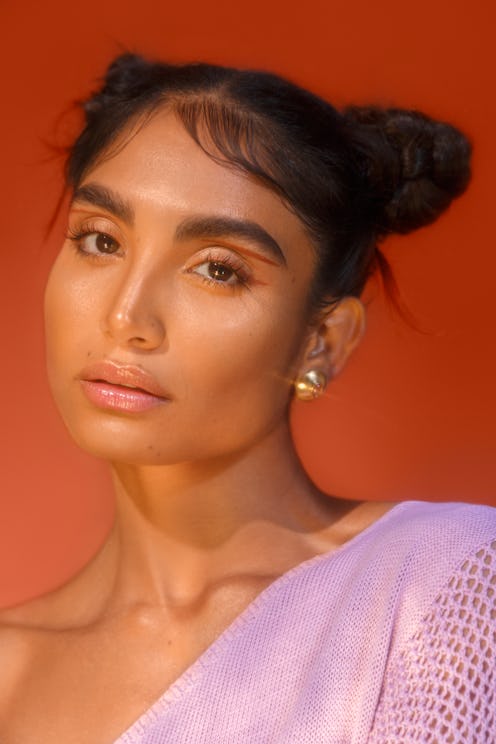 A South-Asian woman modelling Kulfi Beauty products 