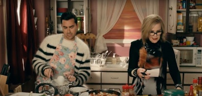David and Moira Rose cook a meal in their kitchen during an episode of 'Schitt's Creek.'