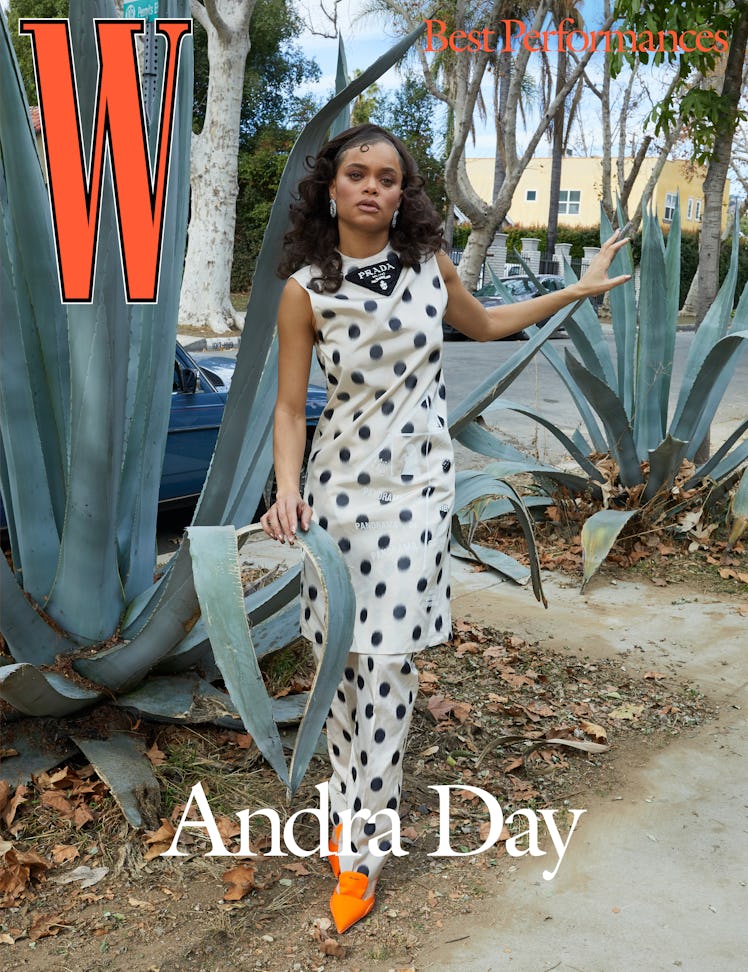 Day wears a Prada dress, pants, and shoes;  Cartier earrings.