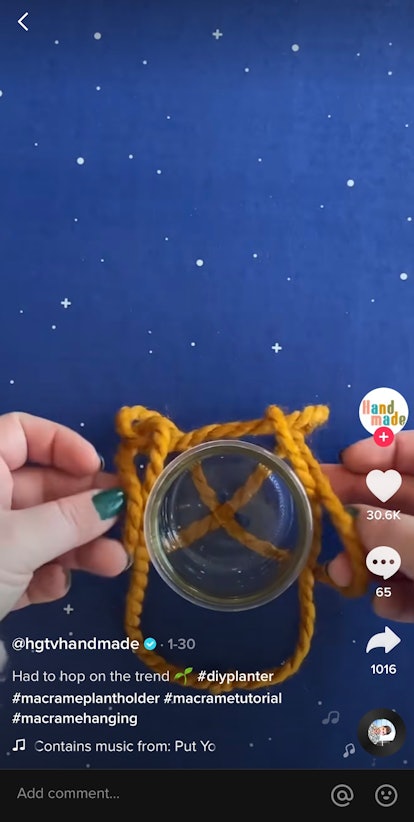 A TikTok user folds a yellow rope while making a macrame plant hanging on the app.