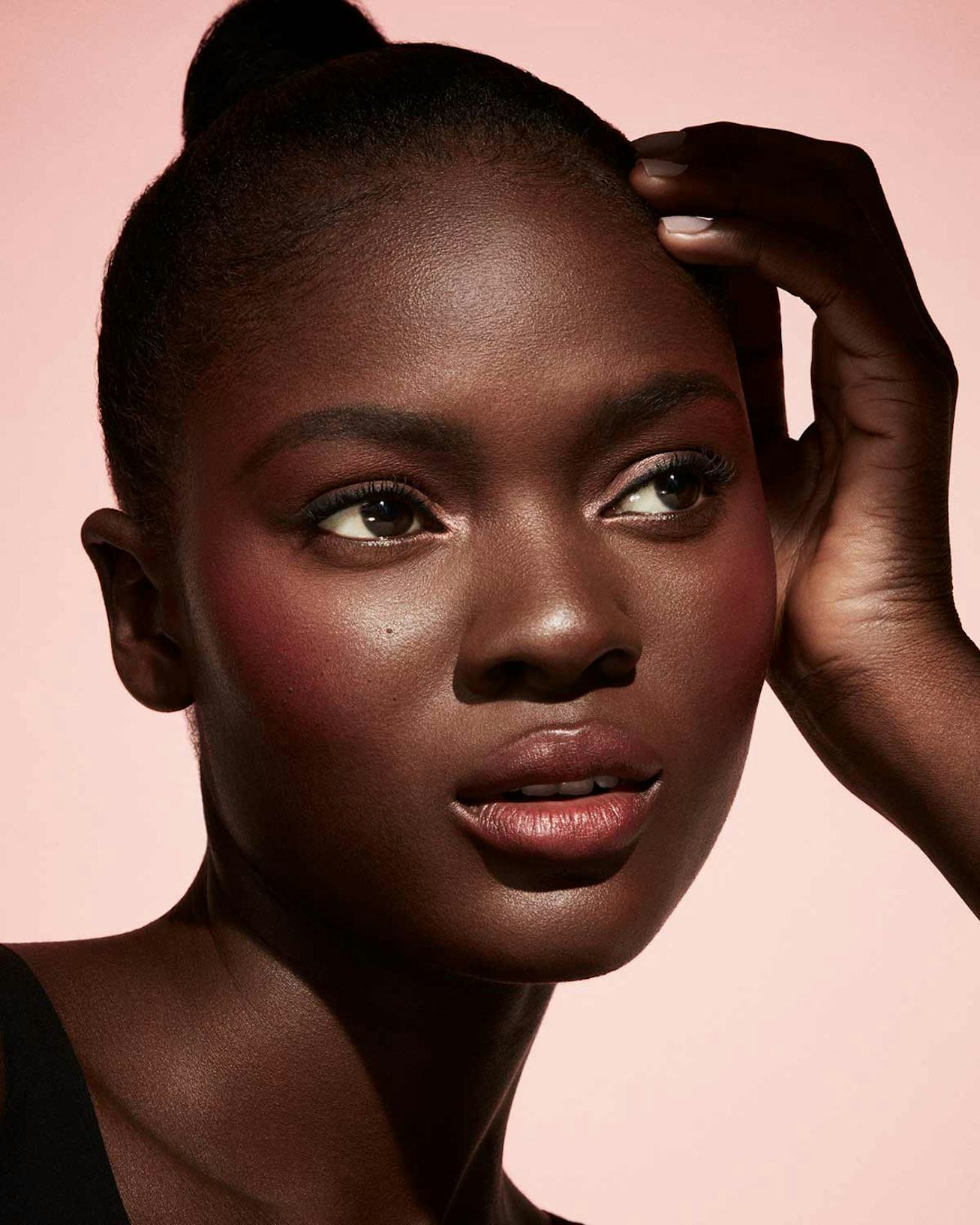 Model wearing Fenty Beauty Cheeks Out Freestyle Cream Blush