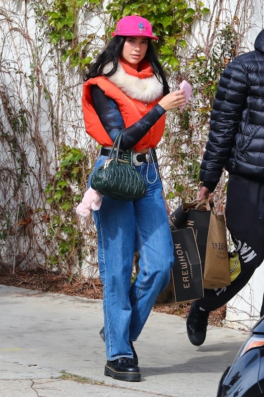 Singer Dua Lipa and boyfriend Anwar Hadid fill up their SUV before getting some groceries at Erewhon...