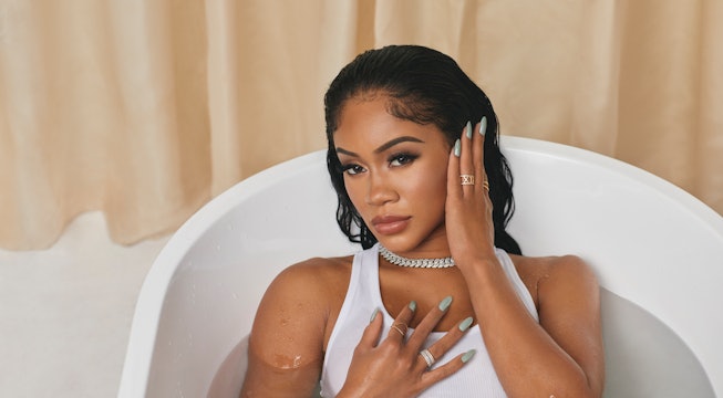 Saweetie wearing Sinful Colors nail polish in light mint green shade