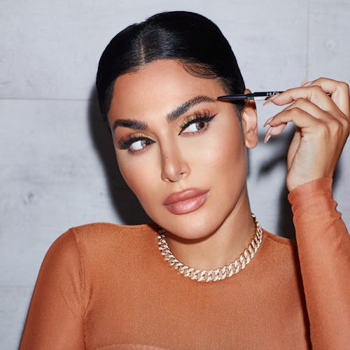 Huda Kattan using Huda Beauty's new #BOMBBROWS Brow Pencil.