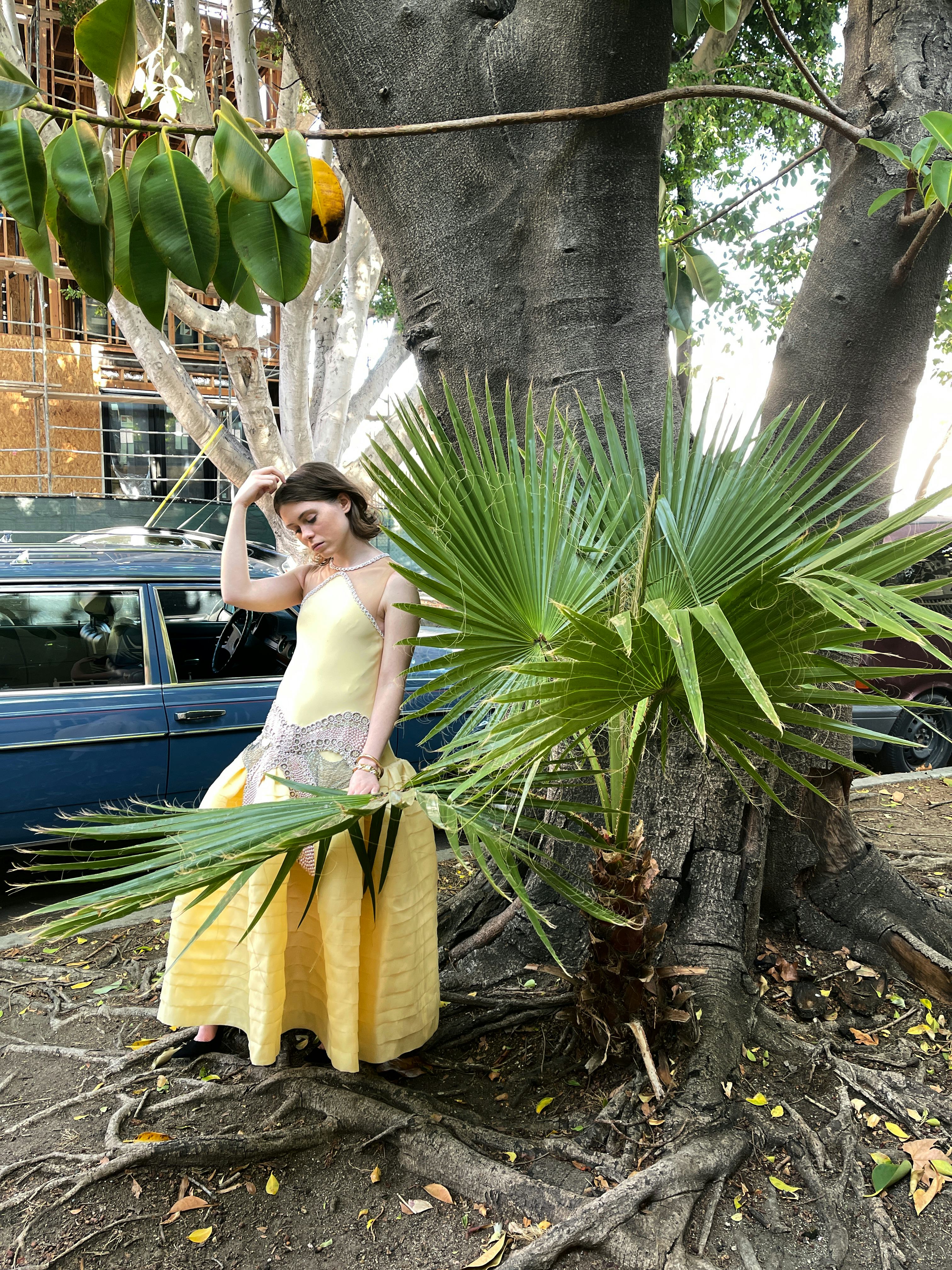 Sophia Lillis wears a Lanvin dress; Cartier bracelet and watch; Manolo Blahnik shoes.