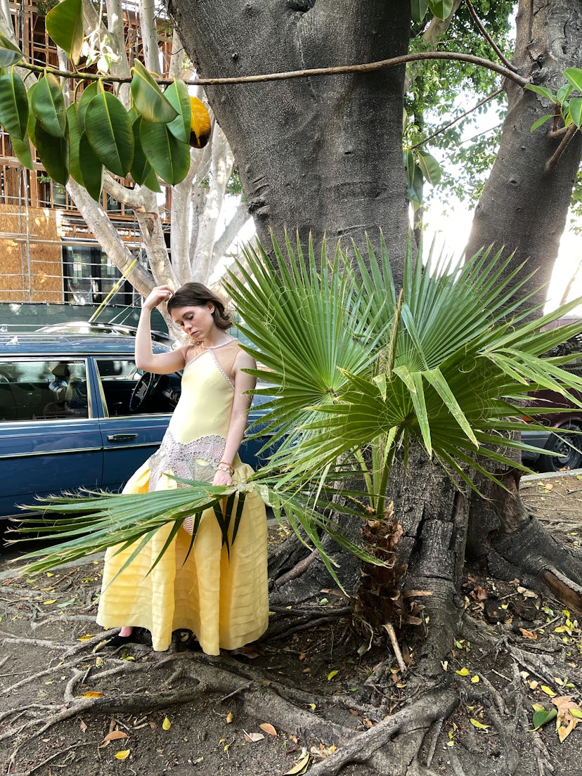 Sophia Lillis wears a Lanvin dress; Cartier bracelet and watch; Manolo Blahnik shoes.