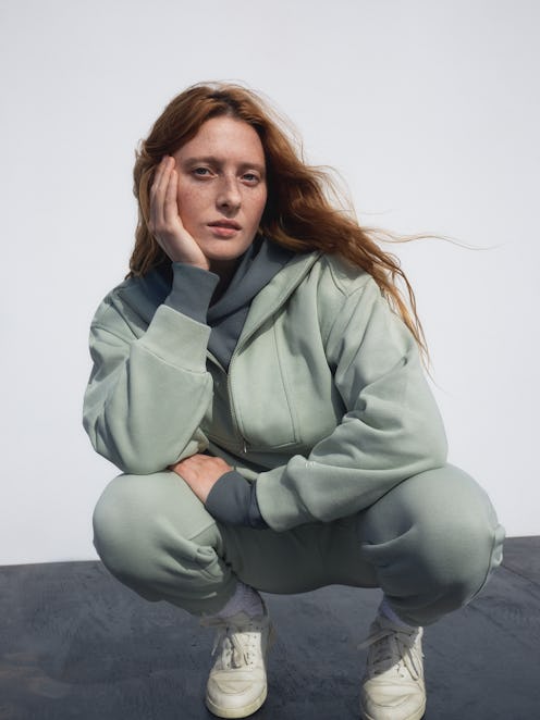 Model appears in an ad for Everlane track collection.