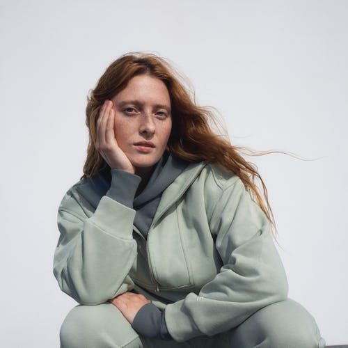 Model appears in an ad for Everlane track collection.