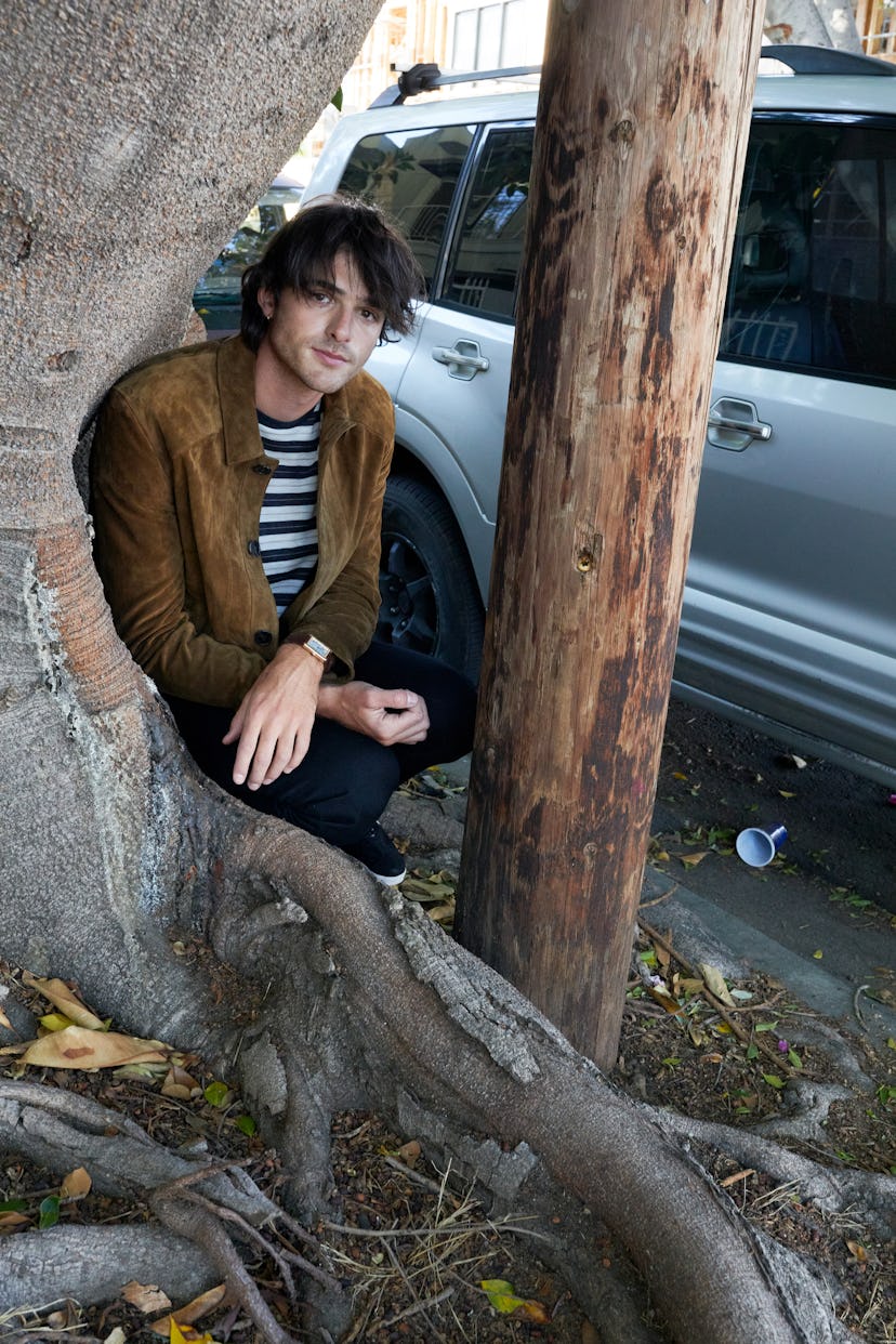 Jacob Elordi wears a Saint Laurent by Anthony Vaccarello jacket, T-shirt, and jeans; Cartier watch; ...
