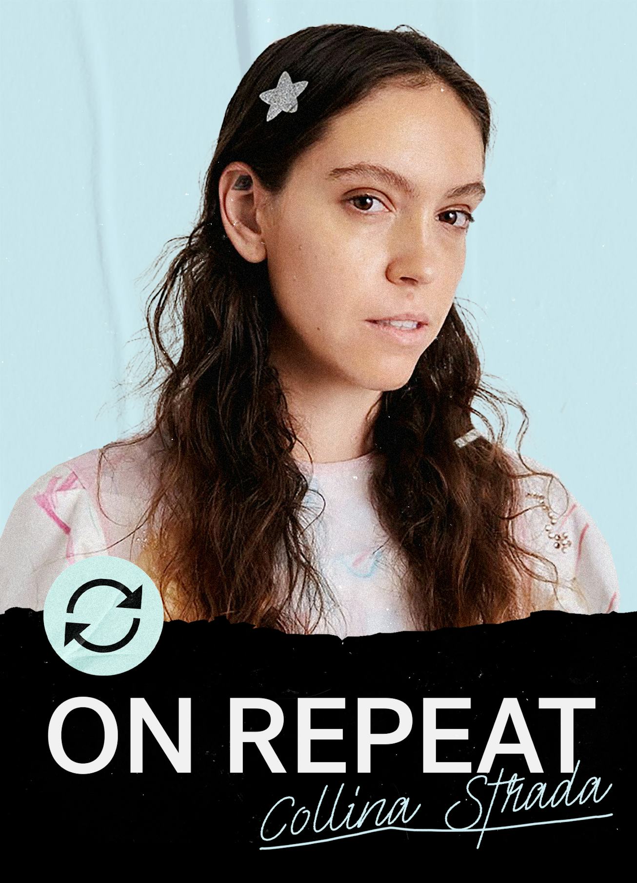 Collina Strada with a star-shaped clip in her hair, wearing a pink sweater with stars on it with the...