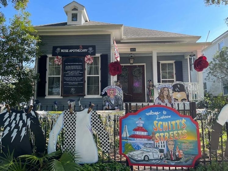 A home decorated like 'Schitt's Creek' has David Rose sweaters lining the front gate for Mardi Gras....