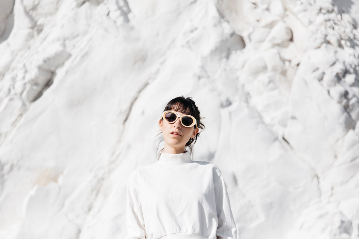 Snow puns, woman in front of snow