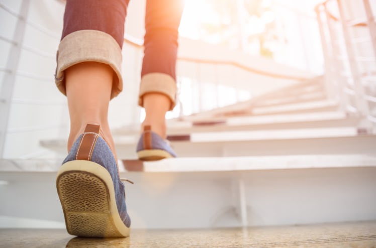 woman walking up the stairs