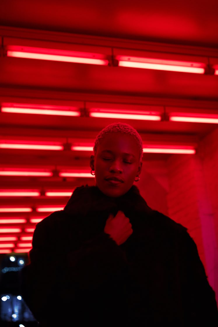 young woman in neon light during February 2021 full moon