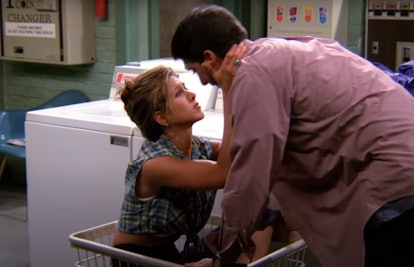 Rachel from 'Friends' sits in a laundry cart while wearing a hair clip and plaid crop top as she get...