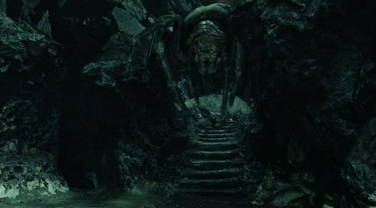 Shelob wrapping Frodo in a web in Lord of the Rings: Return of the King