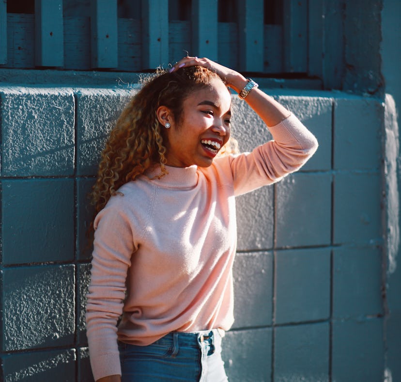 Happy young woman representing Pisces' best traits and qualities.