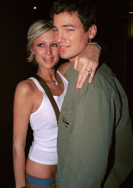 Model Paris Hilton and her then-fiance Jason Shaw, embrace at "The Lounge" March 8, 2002 in West Hol...