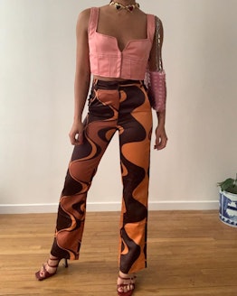 A girl posing with wavy pants