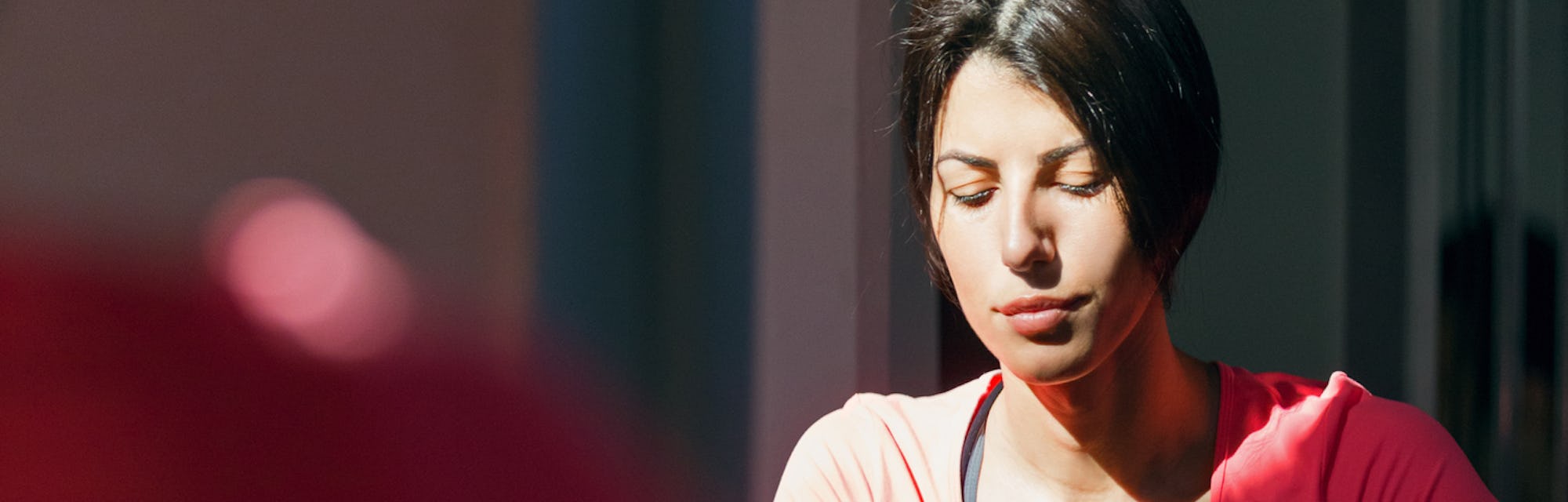 closeup of woman on exercise bike