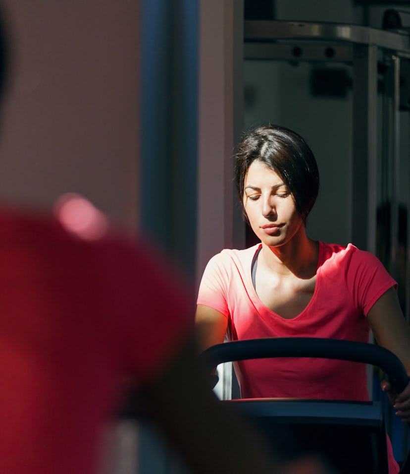 closeup of woman on exercise bike