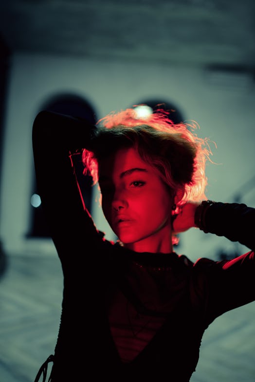 Young woman portrait in red lighting