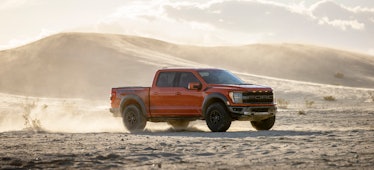 Ford F-150 Raptor red truck in the desert