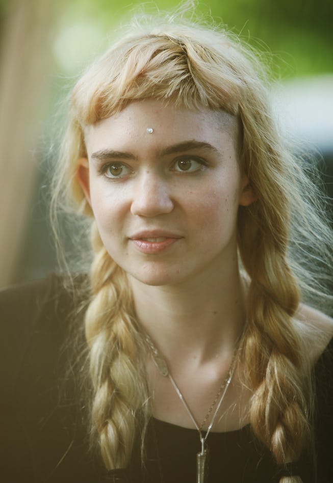 The Beauty Evolution Of Grimes Is Filled With Color And Baby Bangs
