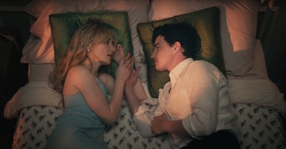 Sabrina Carpenter lays in bed with Gavin Leatherwood during the "Skin" music video.