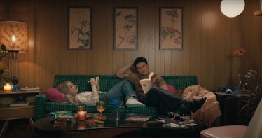 Sabrina Carpenter journals on the couch while Gavin Leatherwood reads a book during the "Skin" music...