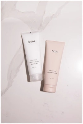 Two bottles of Ouai's curl creme in scented and non-scented. 