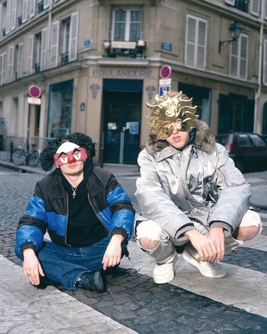 Early photo of Daft Punk in masks. 