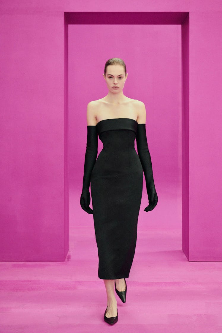 A model in an Emilia Wickstead black dress and gloves at the London Fashion Week