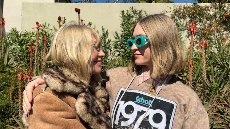 Kim Gordon and Coco Gordon Moore hugging and looking at each other 