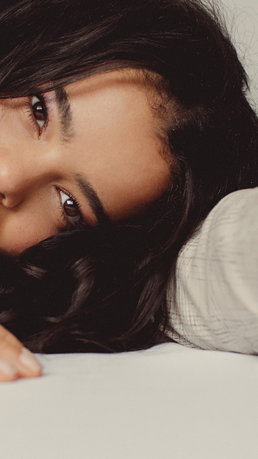 'It's A Sin' star Lydia West posing with head and hands on the floor