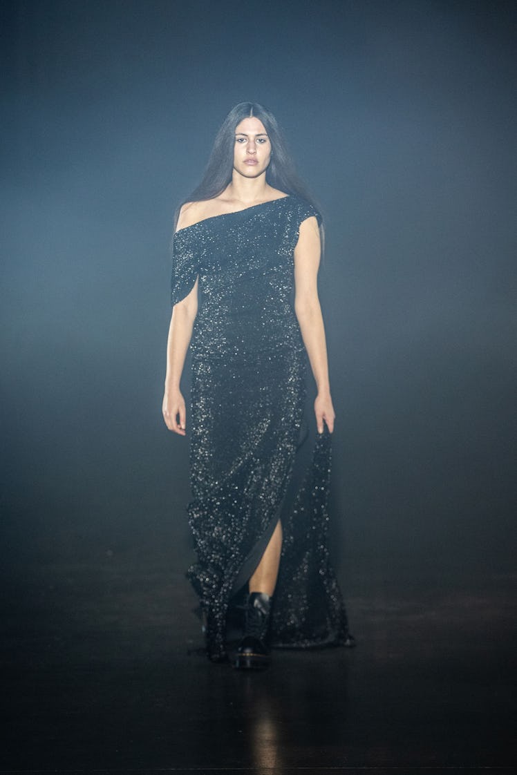 A model in an Art School black sequin dress at the London Fashion Week