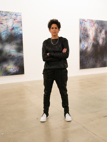 Julie Mehretu photographed at Marian Goodman Gallery in front of (from left) "About the Space of Hal...